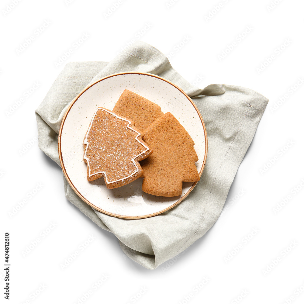 Plate with tasty gingerbread cookies on white background