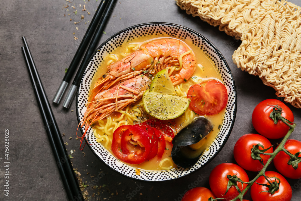 Bowl of tasty Thai soup on dark background