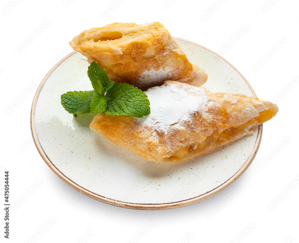 Plate with pieces of tasty apple strudel on white background