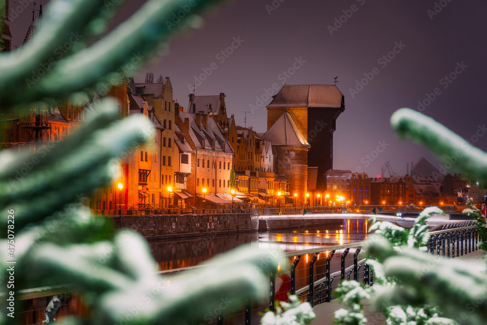 Beautiful architecture of the old town in Gdansk by the Motława river with a historic port crane at 