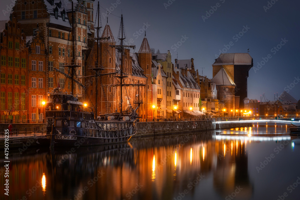 Beautiful architecture of the old town in Gdansk by the Motława river with a historic port crane at 