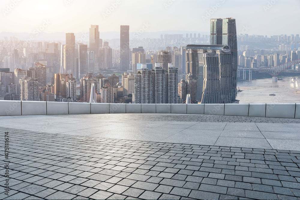 Empty floor with modern city skyline and buildings