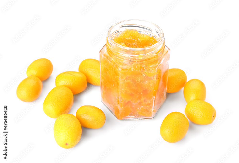 Jar of tasty kumquat jam and fresh fruits on white background