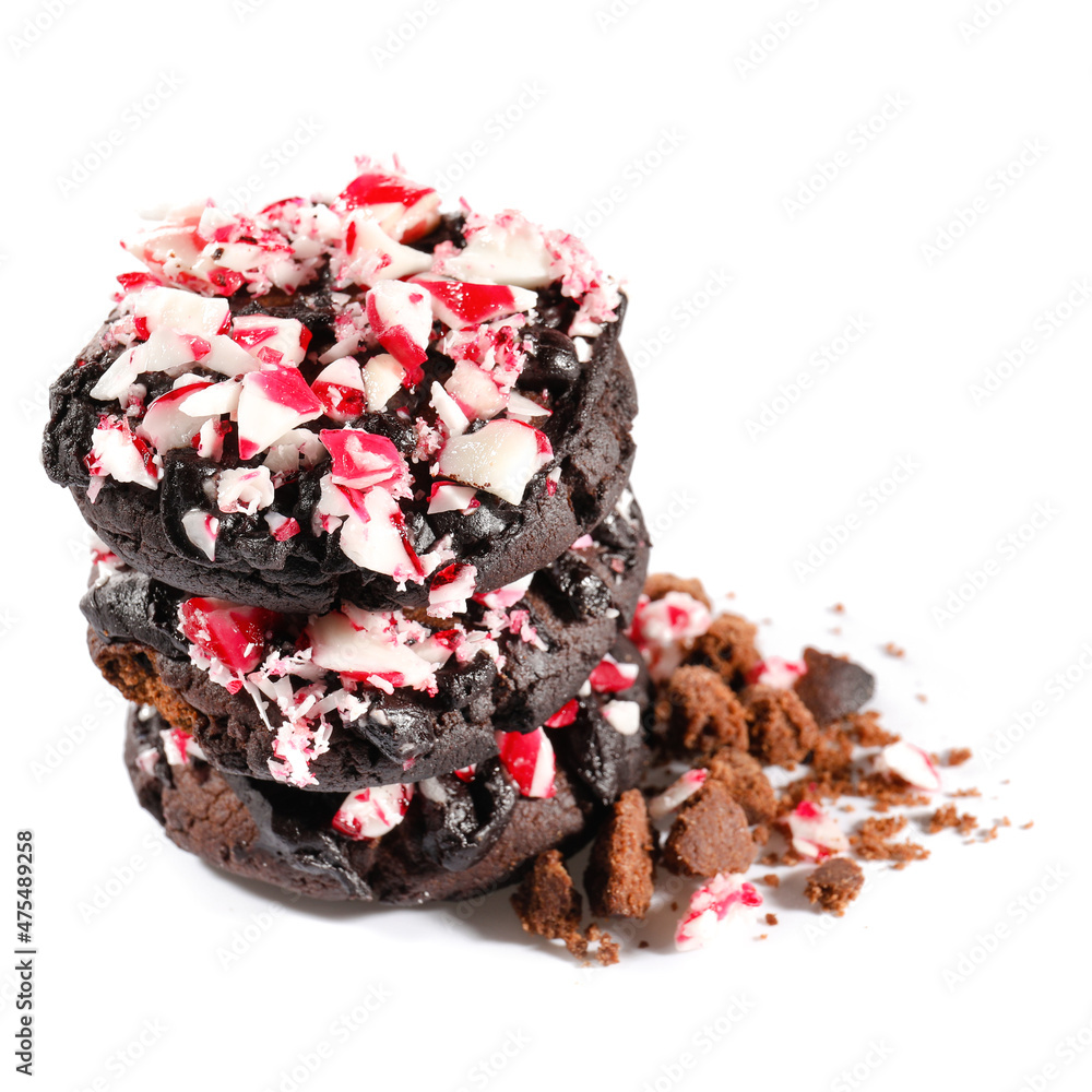 Tasty candy cane cookies on white background