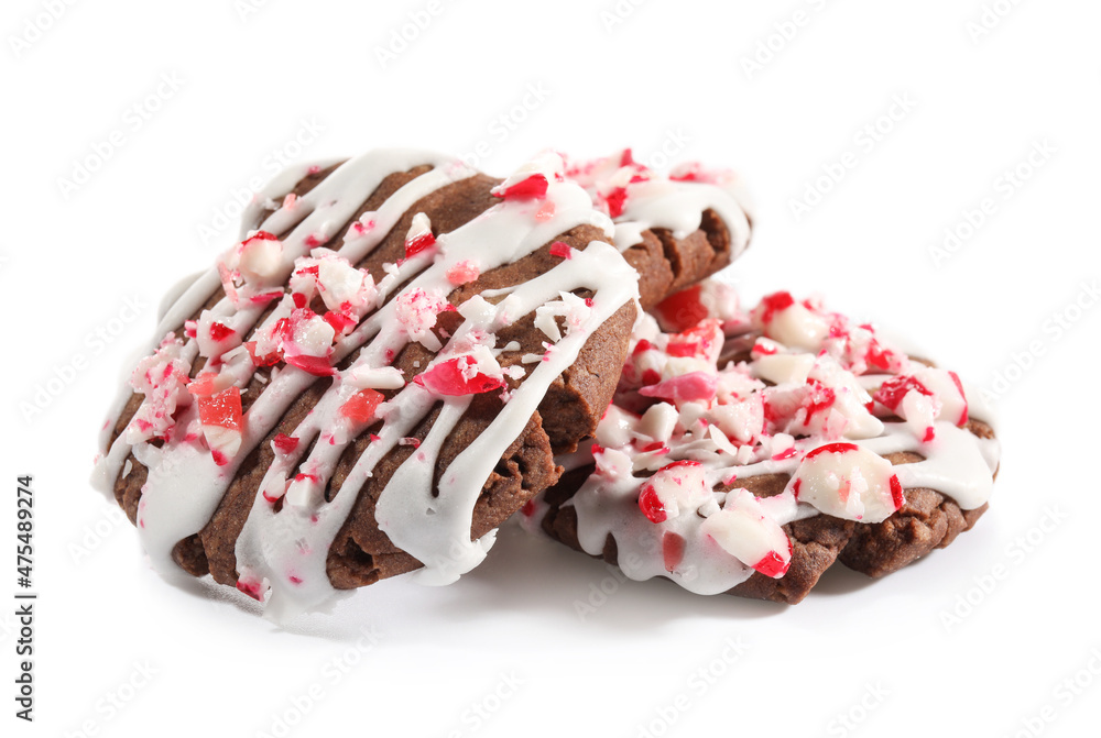 Tasty candy cane cookies on white background