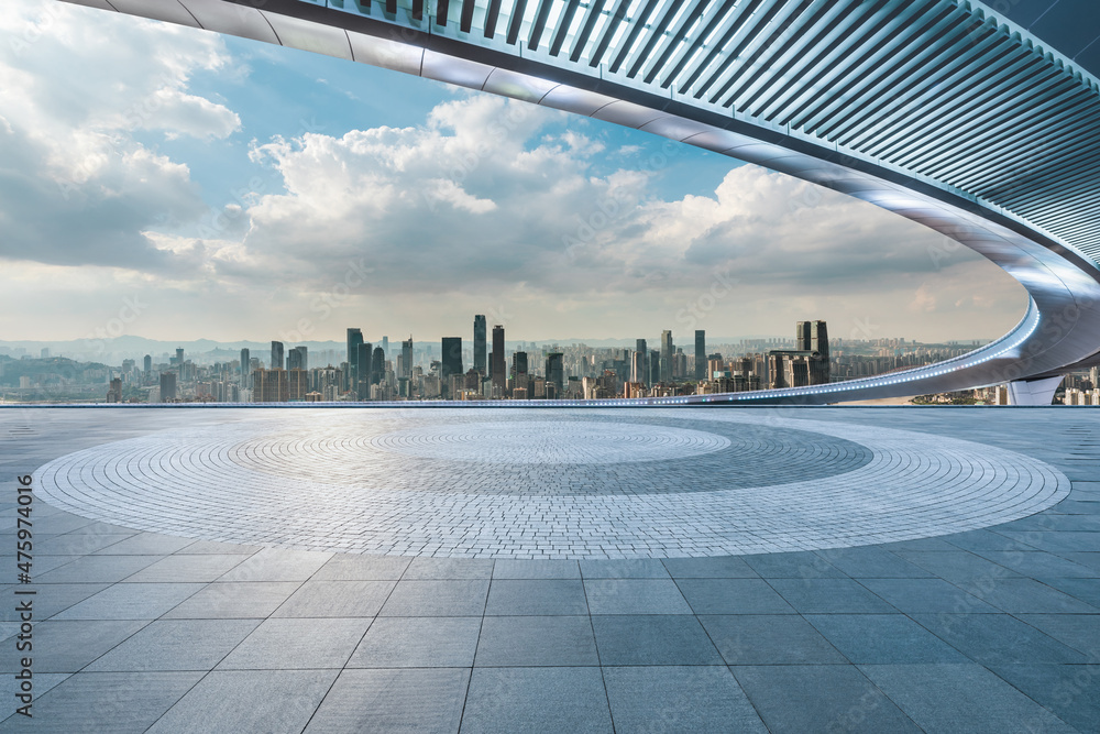 Empty floor with modern city skyline and buildings