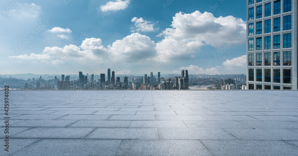 Empty floor with modern city skyline and buildings