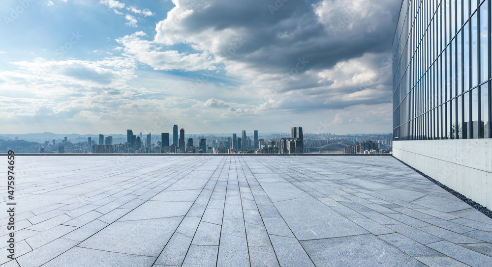 Empty floor with modern city skyline and buildings