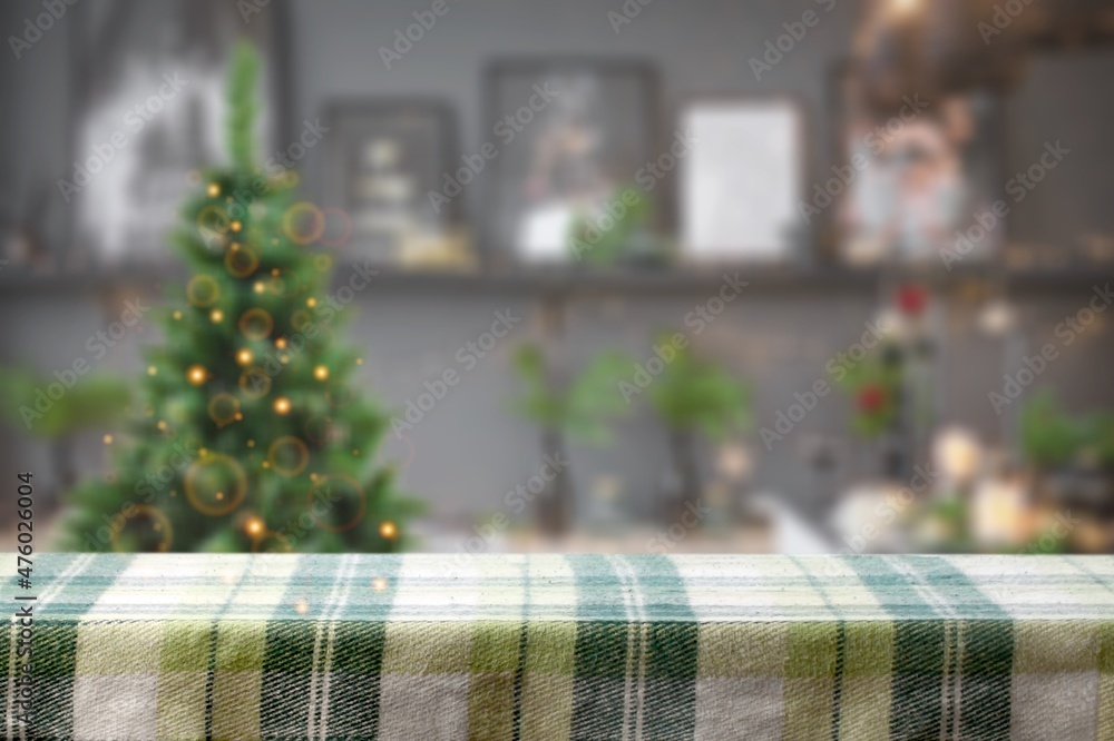 Table space in front of defocused Christmas tree