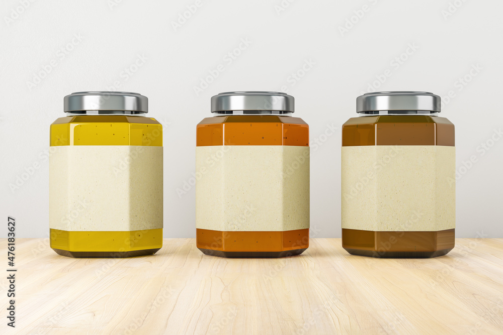 Empty label honey jars on light wooden background. Product packaging, sales and marketing concept. M