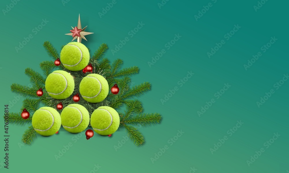 Yellow tennis balls making a shape of christmas tree. Xmas and New year concept.