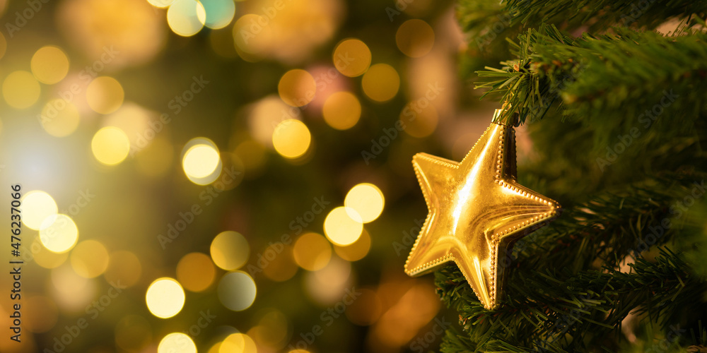 Focus on the Christmas tree star lights and bokeh near the Christmas fireplace.