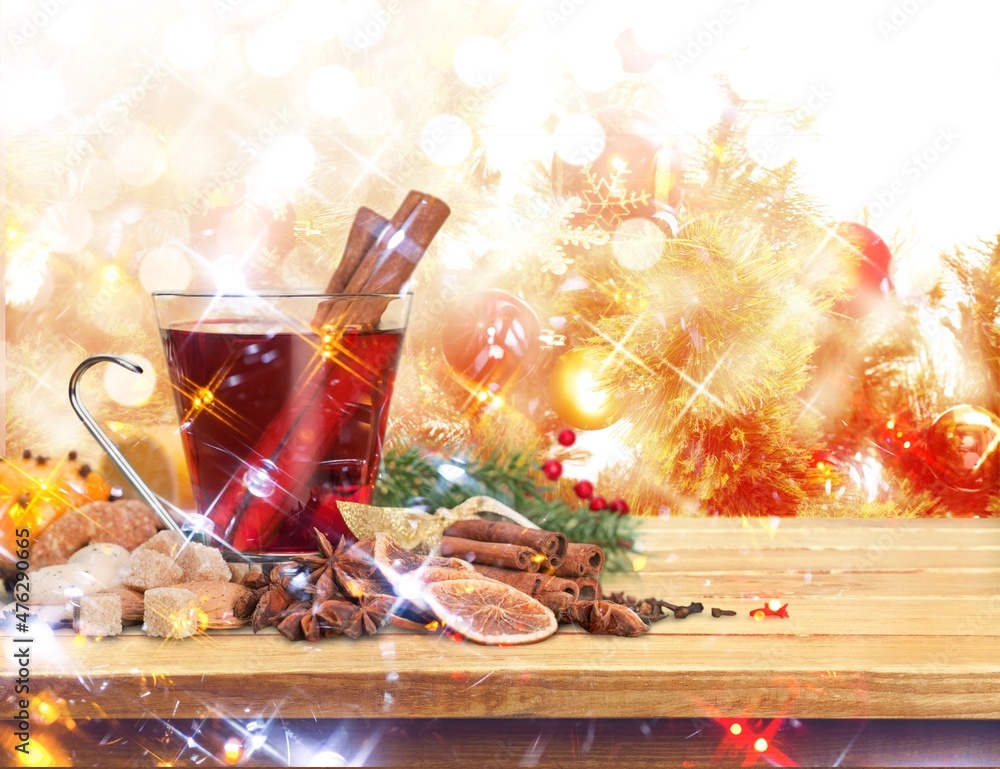 Christmas or New Year hot winter drink, spicy grog cocktail, punch or mulled wine with tea,