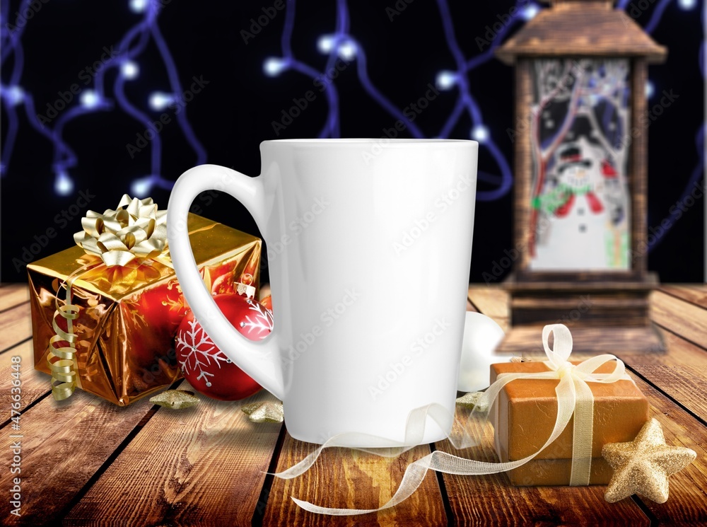 White tea mug with winter xmas decorations and copy space for your design. Christmas promotional con