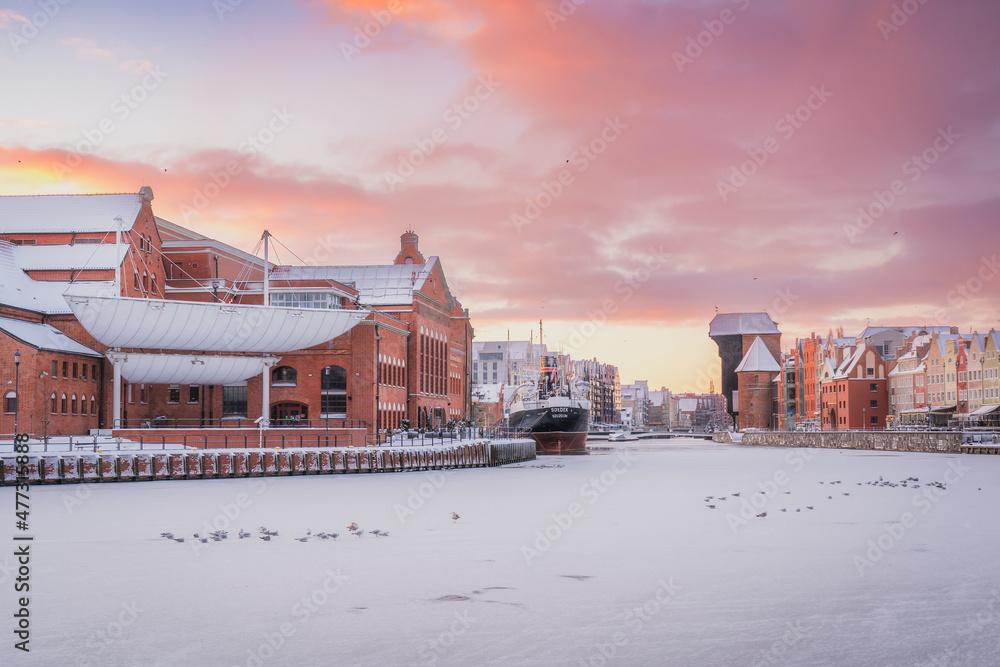 Amazing view of the snow-covered Gdańsk Crane in the morning in winter.