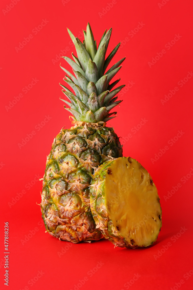 Fresh pineapple on red background