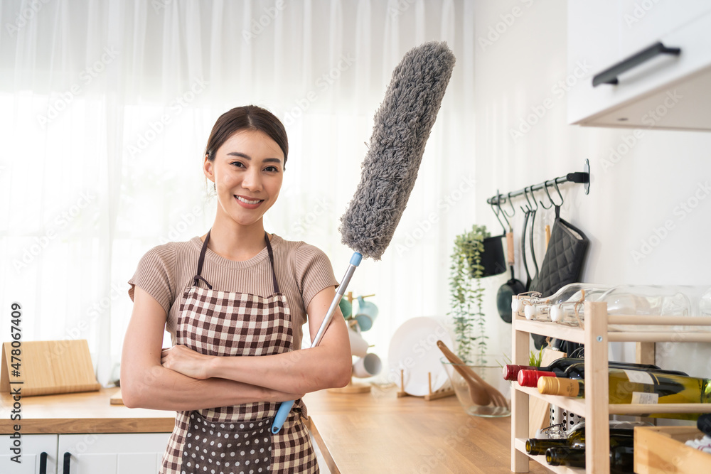 Portrait of Asian young cleaning service woman worker working in house