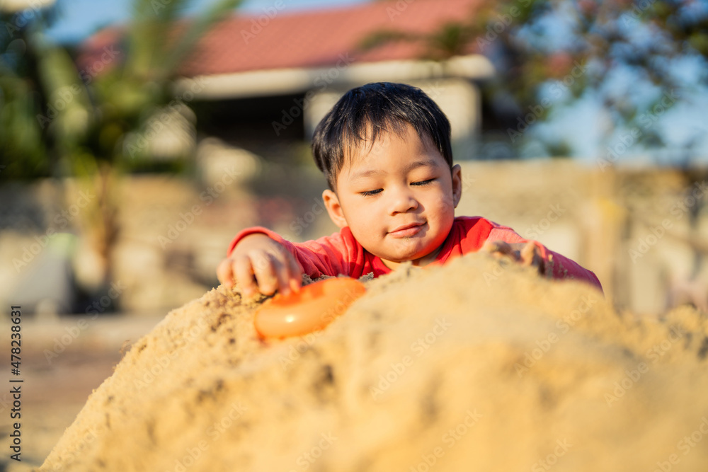 young children asian sand play outdoor