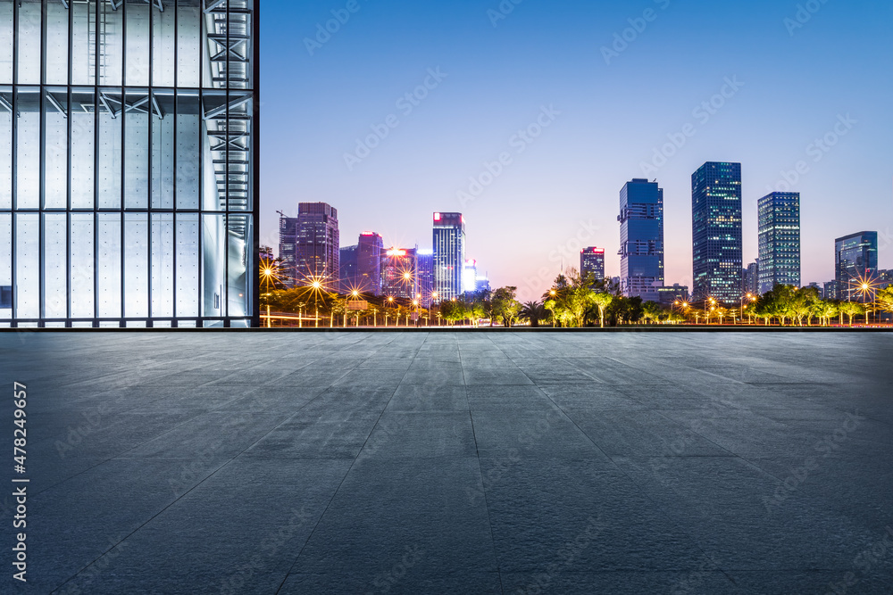 Panoramic skyline and modern commercial office buildings with empty floor in Shenzhen, China.