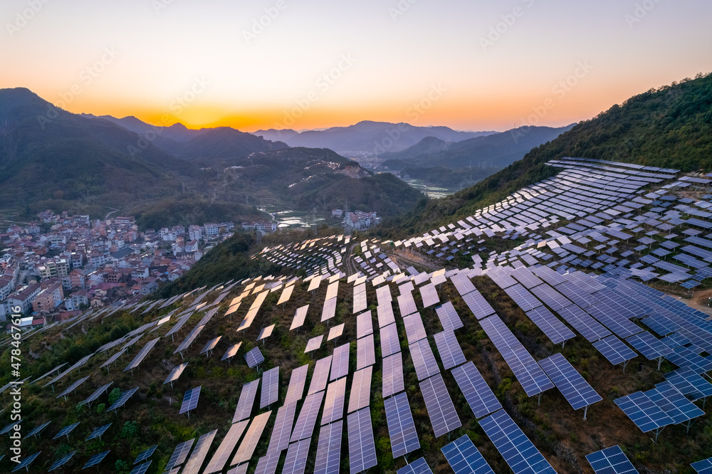 aerial view of solar power panels on hill