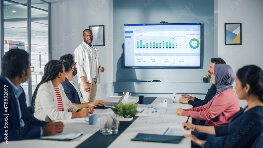 Office Conference Room Meeting Presentation: Black Businessman Talks, Uses Wall TV to Show Fintech G