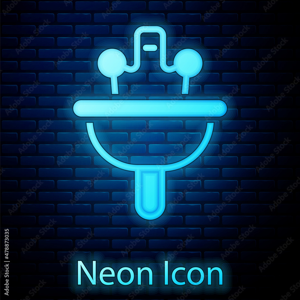 Glowing neon Washbasin with water tap icon isolated on brick wall background. Vector