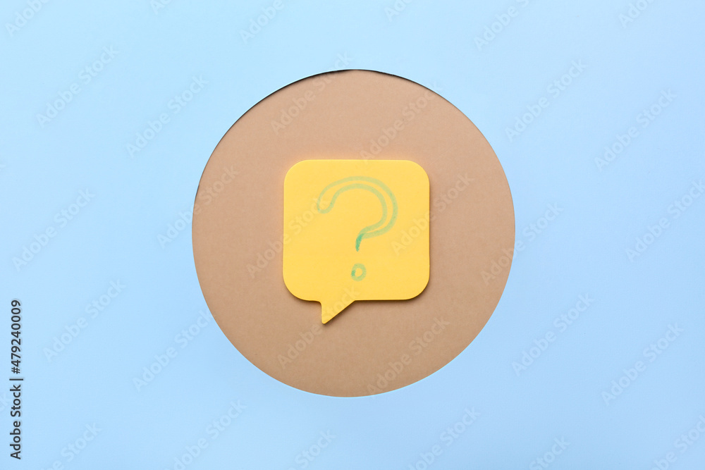 Sticky note with question mark on color background