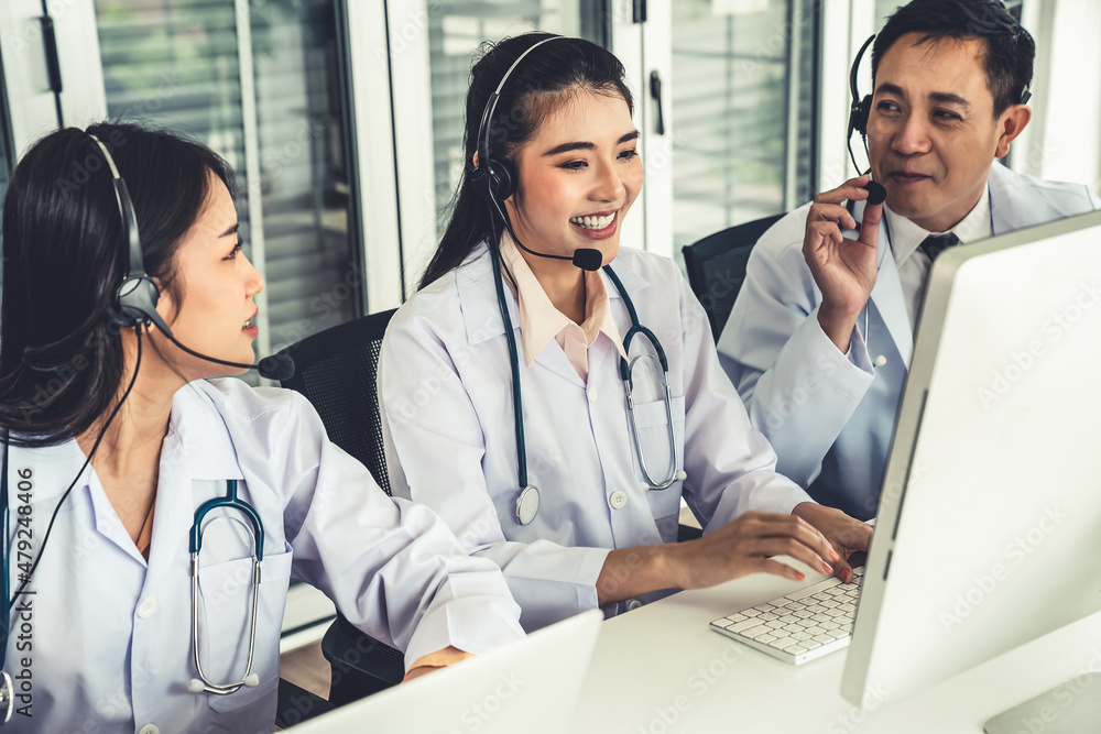 Doctor team wearing headset talking actively on video call in hospital clinic . Concept of telehealt