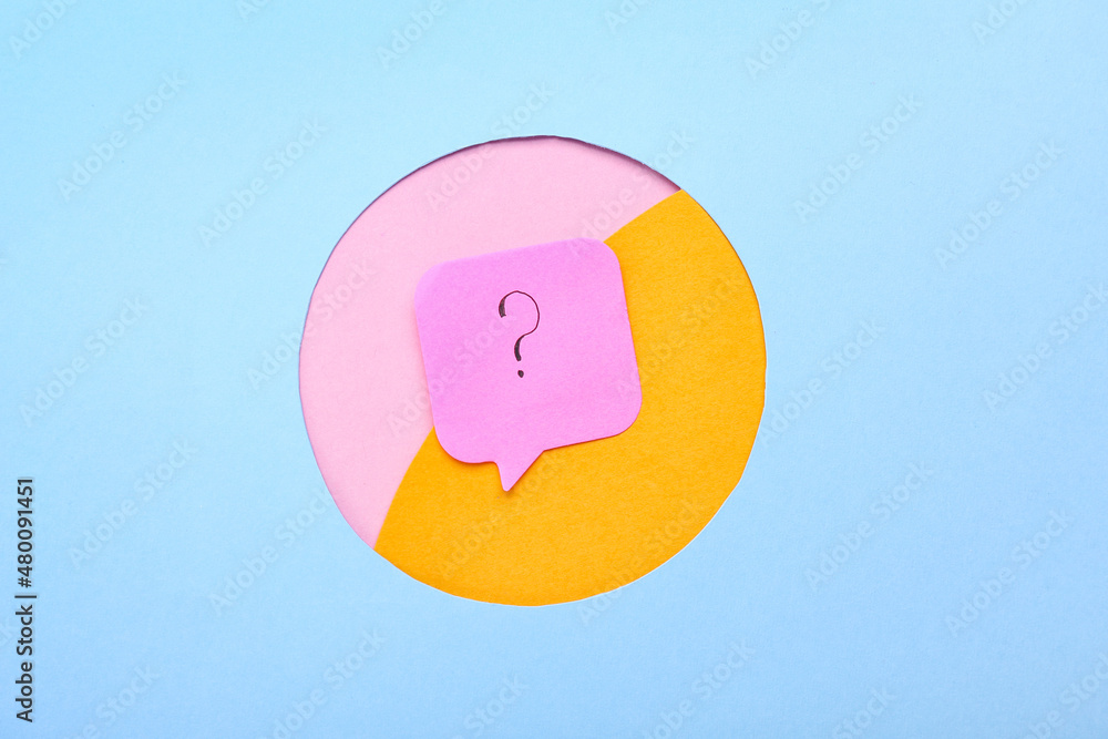 Pink sticky note with question mark on color background