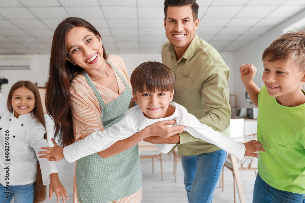 Portrait of happy family at home