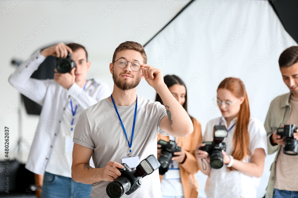 Male photographer during classes in studio