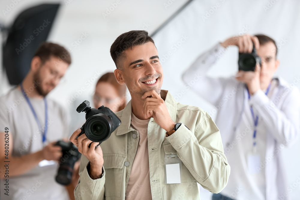 Male photographer during classes in studio