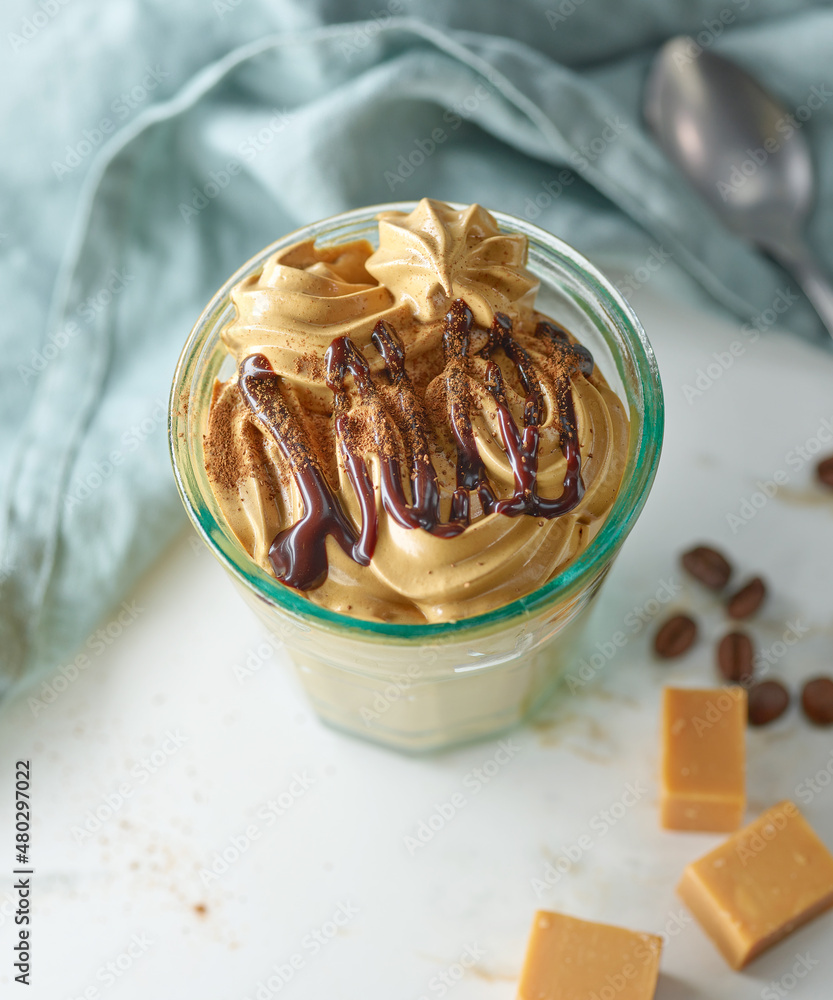 glass of whipped coffee and caramel mousse cream