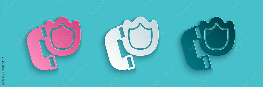 Paper cut Telephone handset with security shield icon isolated on blue background. Phone sign. Paper