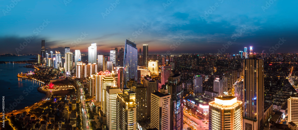 Aerial photography night view of modern city buildings in Qingdao, China