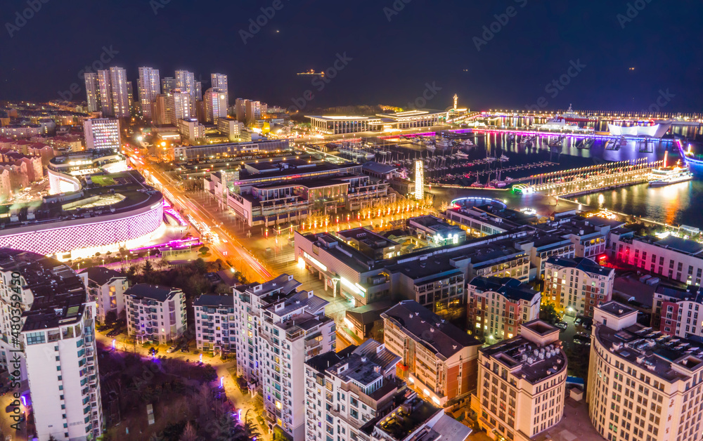 Aerial photography night view of modern city buildings in Qingdao, China