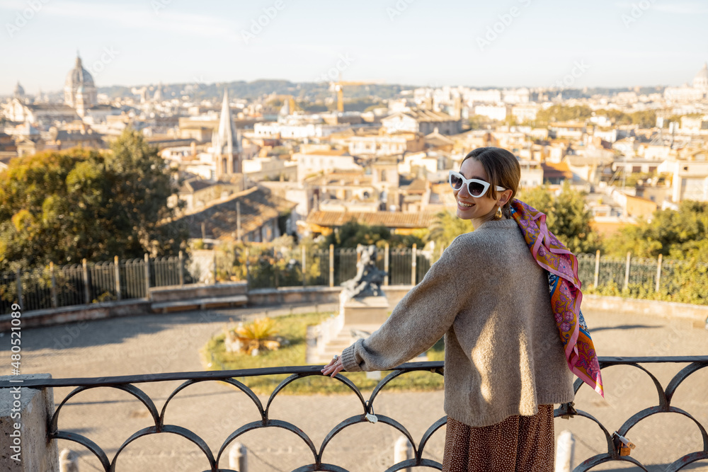 Woman enjoying beautiful morning cityscape of Rome, walking in Villa Borghese Park. Old fashioned wo