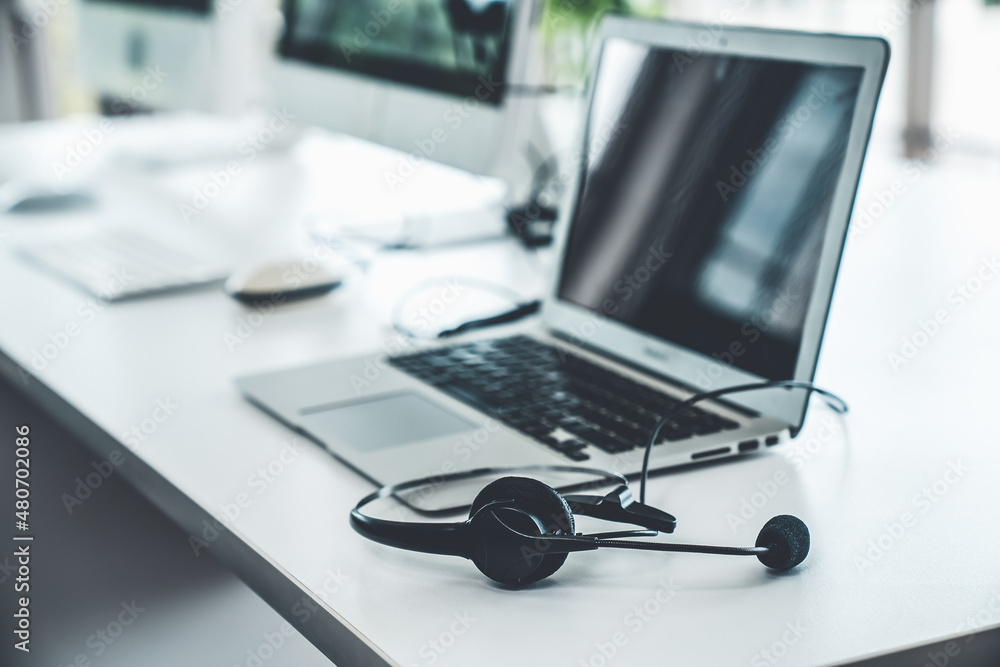 Headset and customer support equipment at call center ready for actively service . Corporate busines