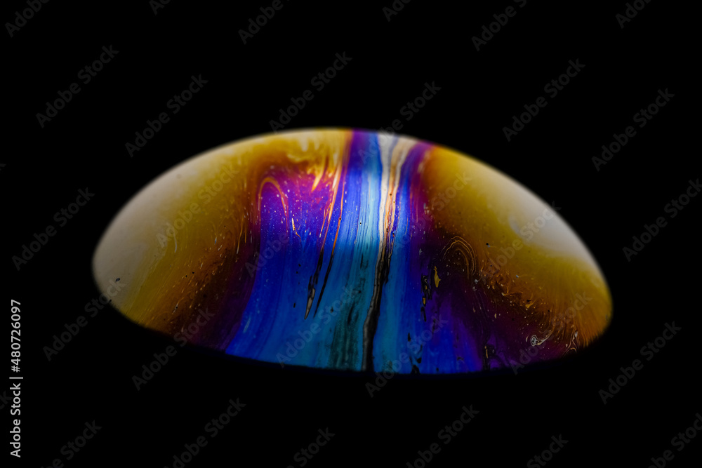 Vibrant colored multicolor psychedelic alien planet in the darkness of the universe, soap bobble clo