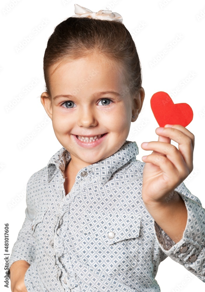 Little girl holds red hearts.