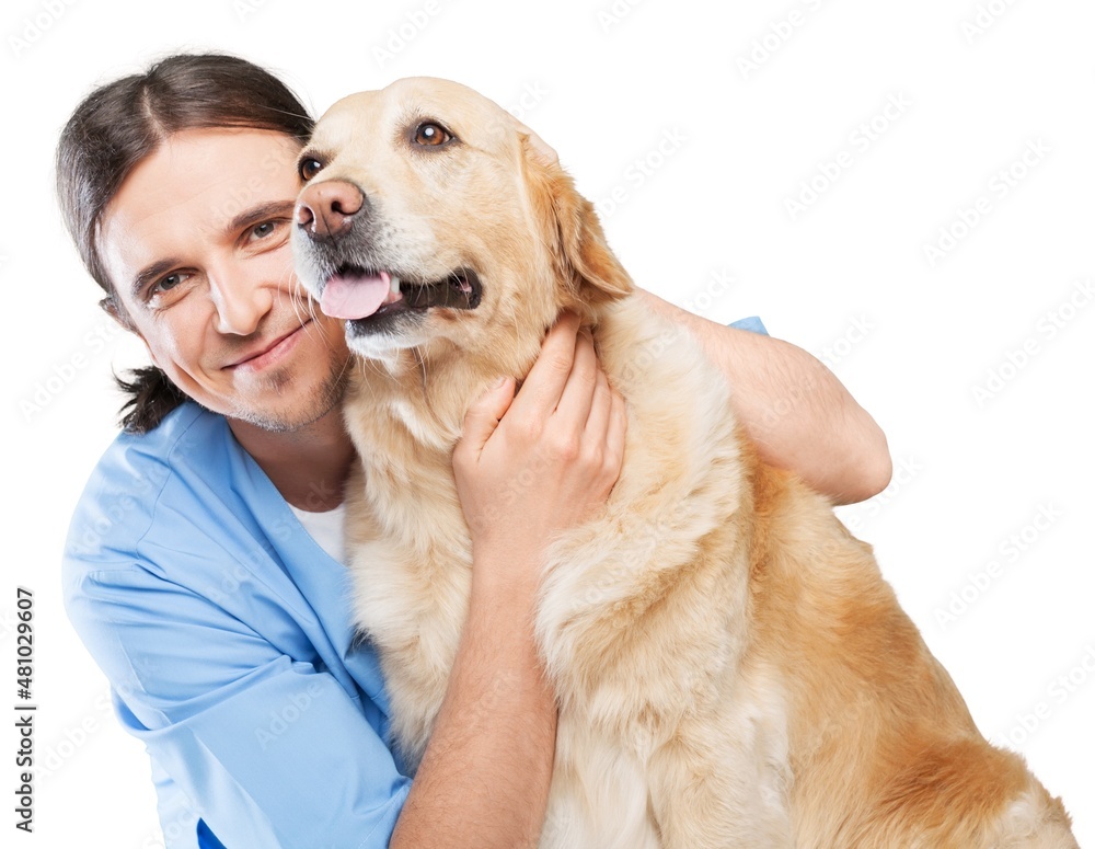 Happy young couple holding their dog