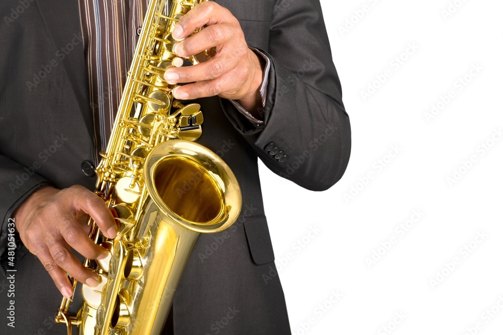 Saxophonist. Man playing on the gold saxophone