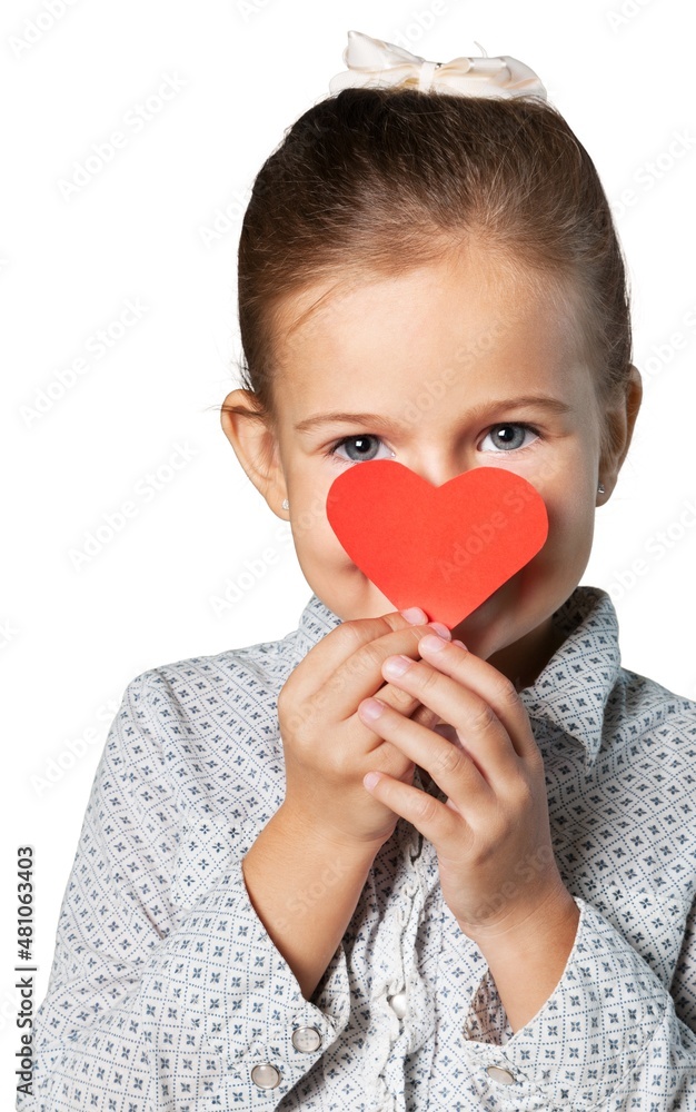 Little girl holds red hearts.