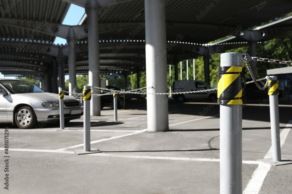 Car parking under canopy near supermarket