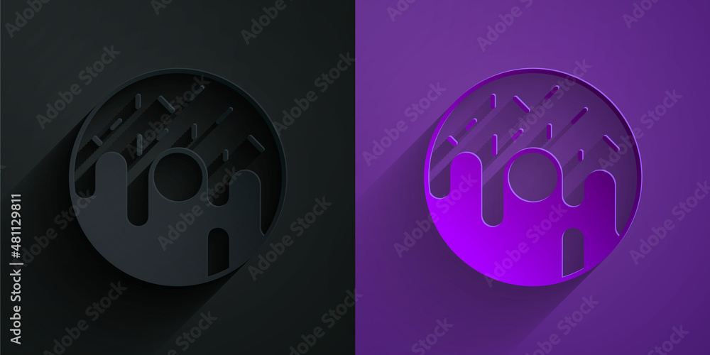 Paper cut Donut with sweet glaze icon isolated on black on purple background. Paper art style. Vecto