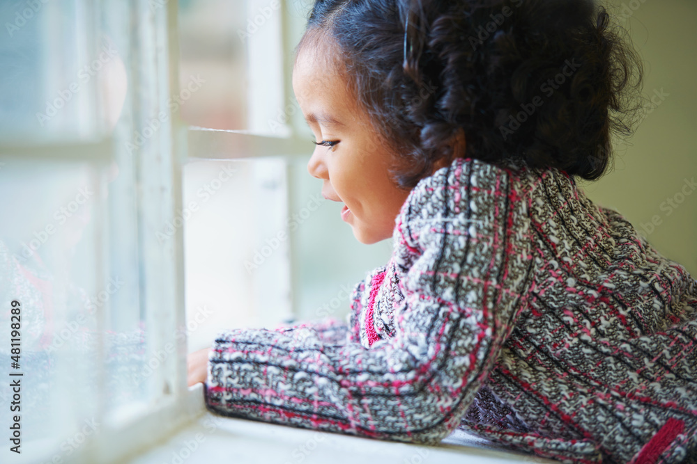 Learning as she grows. Shot of a cute little girl at home.