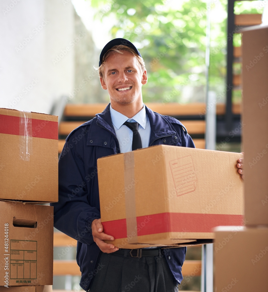 Delivering direct to your door. Shot of a happy courier holding a box.