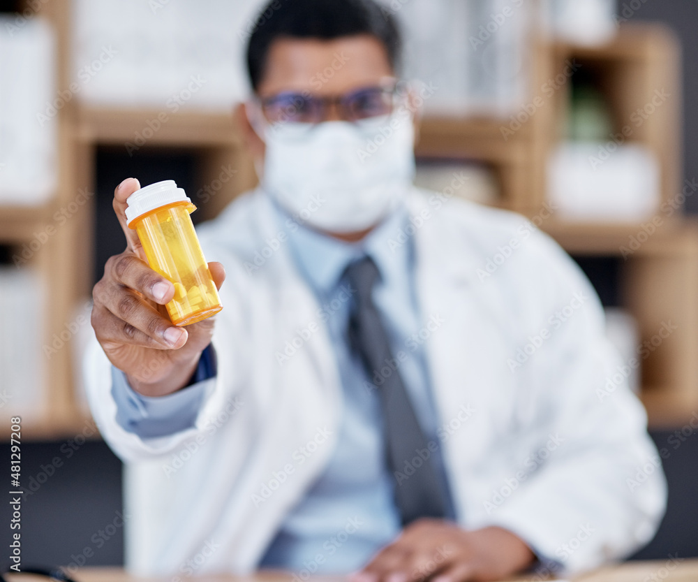 These meds come highly recommended. Closeup shot of an unrecognisable doctor holding a bottle of pil