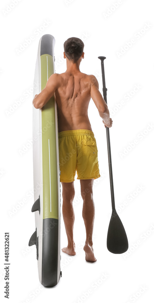 Handsome young man with board for sup surfing and oar on white background