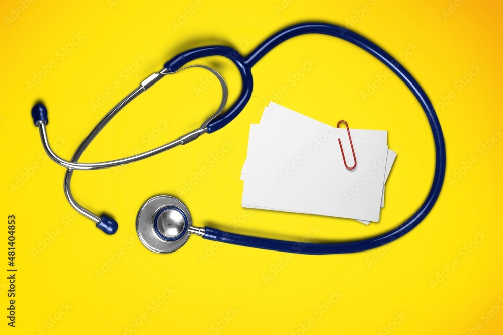 Medical concept. A card with stethoscope on the desk